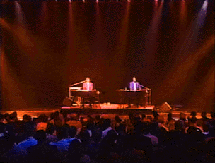Chris and Doug singing and playing keyboards onstage - click to enlarge